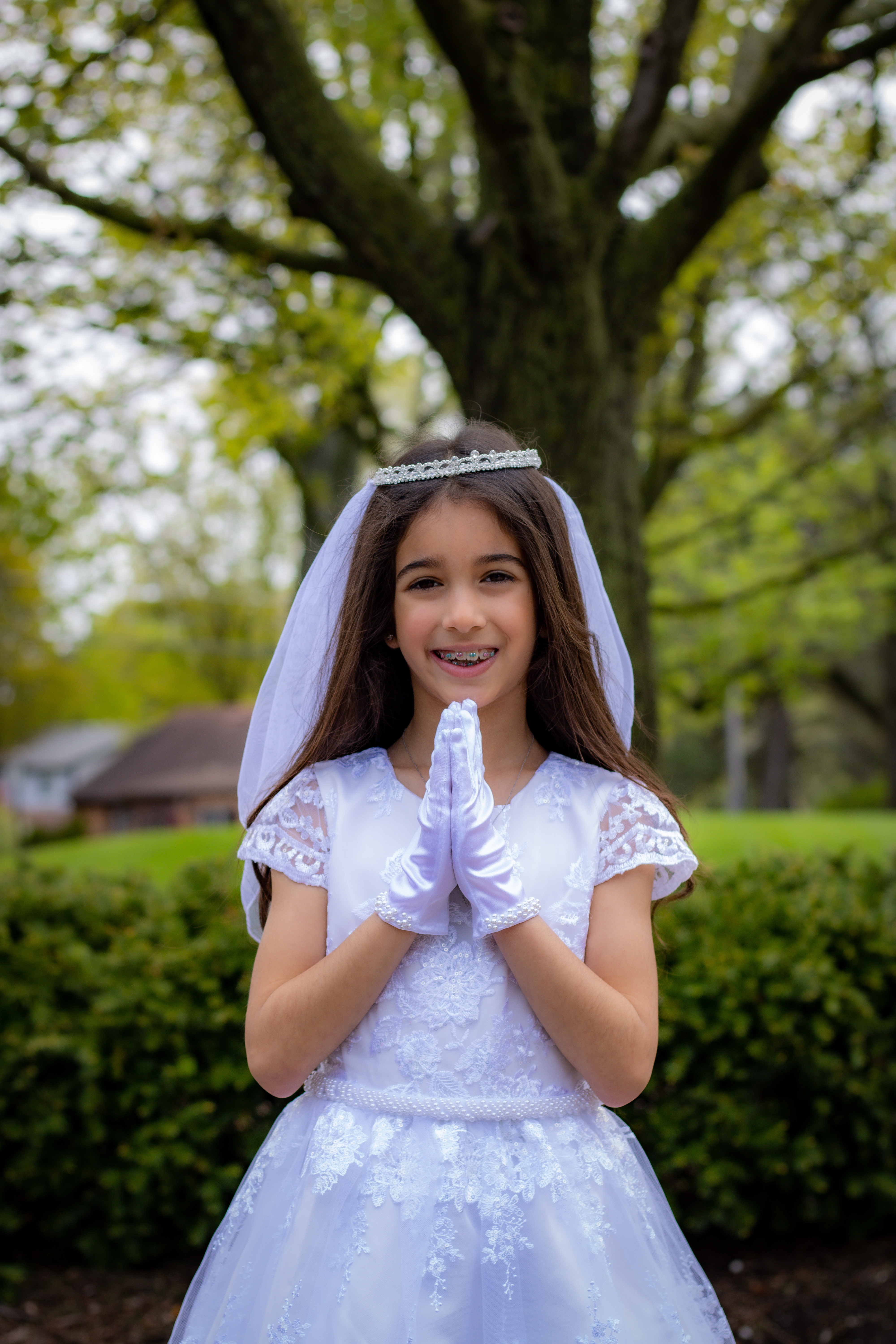 Communion portrait with folded hands