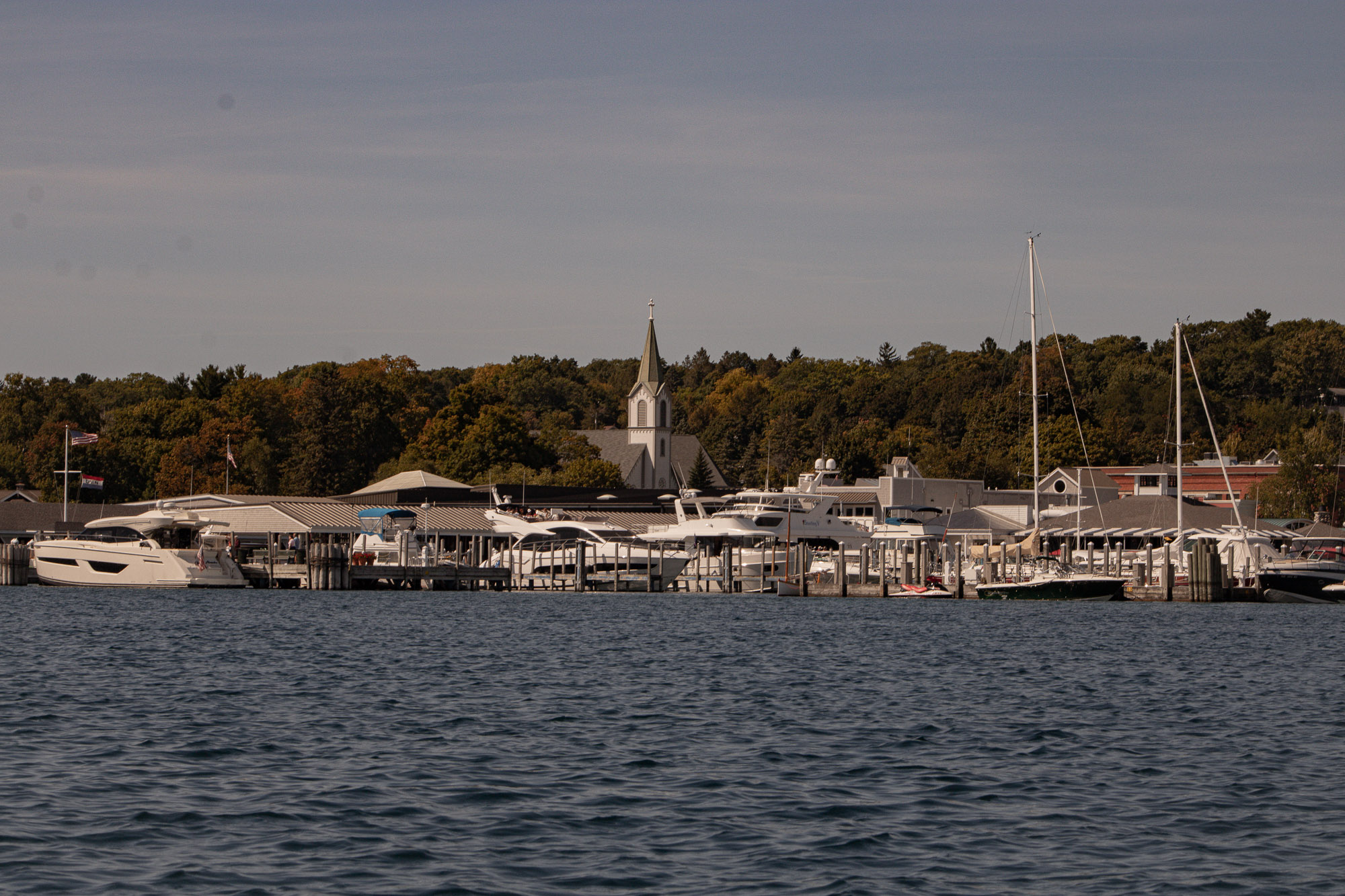Harbor Springs waterline with soft clouds